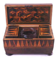 Tunbridge ware tea chest with parquetry in various woods, the interior canisters continuing the pattern of the sides, circa 1825. eg01.jpg (56925 bytes)