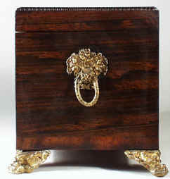 regneo06.jpg (69595 bytes) A Regency Neoclassical Rosewood Tea Chest with Brass inlay Circa 1810.