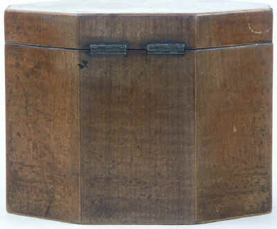 An Octagonal Caddy veneered in harewood and inlaid with oval marquetry panels depicting country flowers. Circa 1790