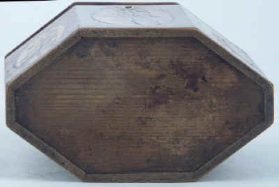 An Octagonal Caddy veneered in harewood and inlaid with oval marquetry panels depicting country flowers. Circa 1790