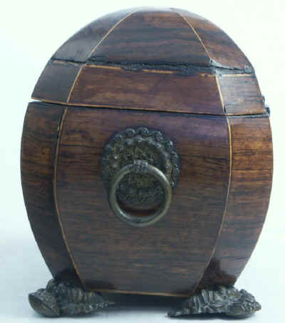 A bombe-shaped Regency  twin compartment tea caddy veneered in rosewood strung with boxwood with embossed feet and handles. Circa 1820.