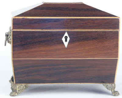 A  Regency shaped rosewood caddy with pyramided top with  brass  side handlesand feet Circa 1830