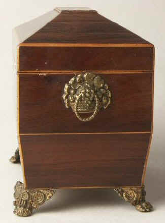 A  Regency shaped rosewood caddy with pyramided top with  brass  side handlesand feet Circa 1830