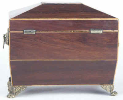 A  Regency shaped rosewood caddy with pyramided top with  brass  side handlesand feet Circa 1830