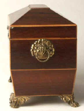 A  Regency shaped rosewood caddy with pyramided top with  brass  side handlesand feet Circa 1830