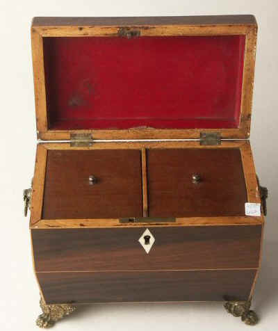 A  Regency shaped rosewood caddy with pyramided top with  brass  side handlesand feet Circa 1830