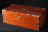 Writing box veneered in figured walnut, with rounded brass surround and brass lines. Strong Bramah lock. Enlarge Picture