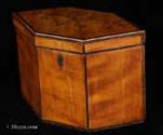 734TC: Hexagonal shaped single compartment tea caddy veneered with satin birch crossbanded with kingwood to top and front sides and inlaid to top with a depiction of crossed branches, Circa 1790.