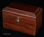 735TC: Two compartment tea caddy with saw-cut mahogany cross banded with boxwood. Inside the two compartments have supplementary lids of solid mahogany with turned handles.  The Caddy retains some of its original lead foil on the inside. Circa 1800. 