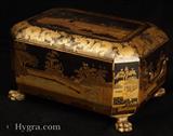 895TC:Antique Chinese export lacquer tea chest with gold decoration depicting tea cultivation and trading scenes painted with a robustness of line and an attention to minutiae and the use of the bright gold contrasted against the black expanses. The caddy opens to a single compartment with two lidded pewter tea canisters with supplementary inner lids.  Cira 1830