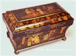 TC 107:  A polychromed tea chest with scenes of oriental life. The pictures are skillfully painted in the manner of the Company school of painting. The original varnish survives, albeit understandably cloudy. Exceptional. Circa:  1815-20.