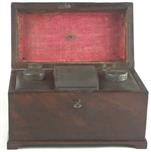 TC127: A flame mahogany tea chest of traditional Chippendale form with cavetto molding to the top and edged subtly with rope twist banding having brass edge escutcheon and Dutch drop handle and containing three tinned ferrous metal lift out containers. Circa 1775.