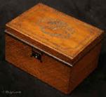 TC138: A continental pearwood tea caddy decorated with cut steel. Circa 1820-1840.