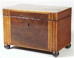  TC147: A mahogany veneered caddy with interesting outlines of contrasting woods, forming stringings and geometric patterns. The top inlaid with a marquetry oval. Circa 1790.