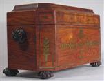TC154: A large and imposing kingwood tea chest inlaid with brass ornament standing on turned and carved feet hand having side handles. Circa 1810.   
