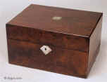 Ref: 640JB:  A richly figured burr walnut  box with mother of pearl escutcheons with lift-out tray and sprung drawer fitted for jewelry. There is a lift-out gold embossed leather framed mirror in the lid with a document wallet behind. The box has a working lock and key  Circa 1850.  Enlarge Picture