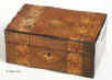 Box veneered in walnut and inlaid in strips of geometric marquetry of light and stained woods circa 1880Enlarge Picture