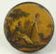 A papier mch snuff box with a hand colored print of a courting scene. English circa 1815.