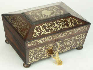 A shaped Regency gadrooned  and brass inlaid Rosewood  box with fitted jewellery tray, circa 1825. Enlarge Picture
