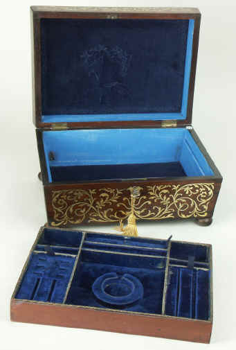 A shaped Regency gadrooned  and brass inlaid Rosewood  box with fitted jewellery tray, circa 1825. Enlarge Picture