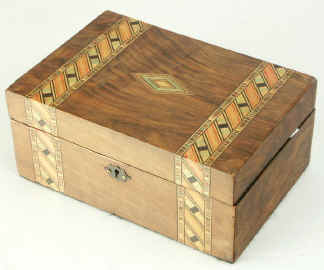 Victorian walnut veneered box inlaid in strips of geometric marquetry circa 1880. Enlarge Picture