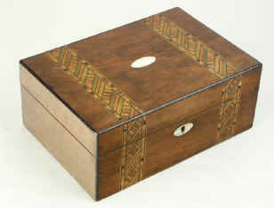 Victorian walnut veneered box inlaid in strips of geometric marquetry circa 1880. Enlarge Picture