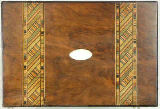 Victorian walnut veneered box inlaid in strips of geometric marquetry circa 1880. Enlarge Picture