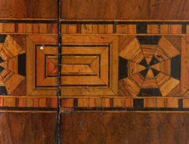 Victorian walnut veneered box inlaid in strips of geometric marquetry circa 1880. Enlarge Picture