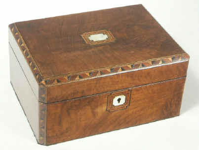 Victorian walnut veneered box inlaid in strips of geometric marquetry circa 1880.