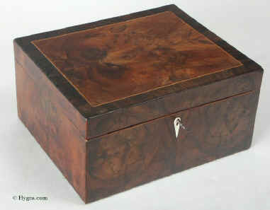 An 18th Century box veneered with oysters of yew the top accented with a box wood line framed by a cross banding of  quartered yew. It is in boxes such as this that the art of wood selection is at its best. Click on image to enlarge.