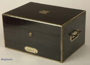 A coromandel ebony box with brass edging with a drawer and tray fited for jewelry circa 1860. Enlarge Picture