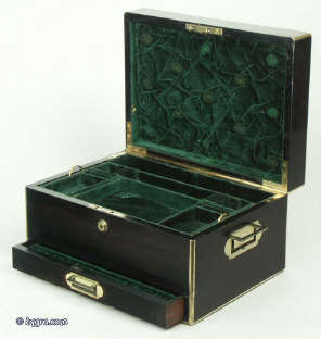 A coromandel ebony box with brass edging with a drawer and tray fited for jewelry circa 1860. Enlarge Picture