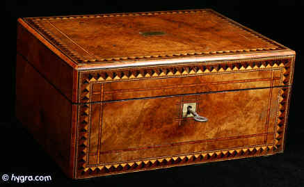 JB401: A Box veneered in well figured walnut and inlaid with parquetry to the top and front.  Inside is the original tray  which has been relined. circa 1880. Enlarge Picture