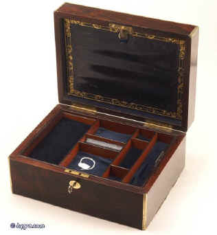 JB311: Brass edged figured rosewood box with brass escutcheon and a brass plate, having a lift out tray. The box has a document wallet with gold and blind embossing to the lid and a working lock and key. Circa 1830 Enlarge Picture