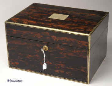 JB318: A very fine fully fitted figured coromandel dressing box by the Pittway Brothers  with engraved and gilded Bramah lock, stop hinges and accents and having a sprung drawer fitted for jewelry. Inside the box is fully fitted lined with leather and velvet and retains its cut crystal bottles and jars with hallmarked silver tops decorated with chassed repouss work and engine turning. There is a lift out tray with further tray containing dressing accessories. There is a lift out reversible mirror and document wallet in the lid. Circa 1863.  Enlarge Picture
