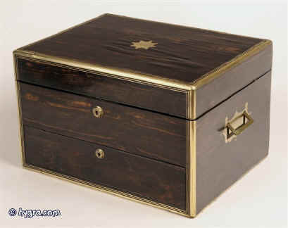 A particularly large brass edged  top quality,  and inlaid box veneered with striated coromandel and having inset brass carrying handles matched Bramah locks and retaining its original velvet lined liftout tray.  The box was  made by  C. Asprey of 166 Bond Street London circa 1860  Enlarge Picture