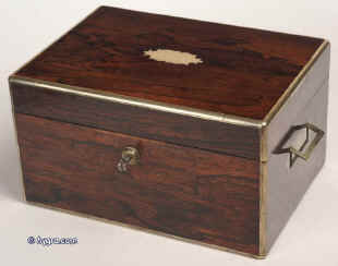 Antique, early 19th Century brass edged box in figured rosewood by T. Briggs of 27 Piccadilly, London, with working Bramah lock, inset side carrying handles, having a velvet lined interior, two (replacement) lift out trays, embossed leather document wallet in lid, circa 1820. Enlarge Picture