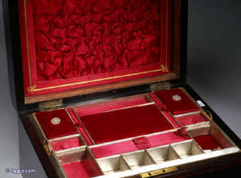 SB124: Victorian figured coromandel sewing box  with mother of pearl cartouche and escutcheon, the inside with fitted liftout tray  with silk covered supplementary lids, Circa 1860.   Enlarge Picture
