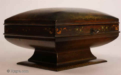 SB473: An artist painted fully fitted  papier mch sewing box of curvilinear form by Jennens and Bettridge, the inside with silk covered lift out tray with supplementary lids in velvet and retaining its original sewing tools in silver and a set of six  turned and carved mother of pearl spools. The painting depicts a life like peacock  in a classical garden complete with statuary and a profusion of flowers.  To increase the lumessence the painter has used a ground of bronze and gold. Circa 1840. Enlarge Picture