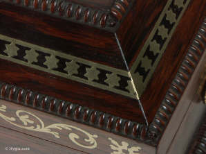 A fully fitted brass inlaid rosewood sewing box with gadrooned edges gilt side carrying handles and gilt feet. Inside the fully fitted sewing tray contains a set of turned ivory spools.  Circa 1810. Enlarge PictureEnlarge Picture