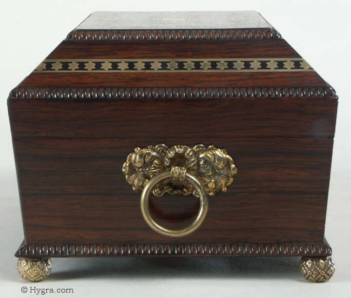 A fully fitted brass inlaid rosewood sewing box with gadrooned edges gilt side carrying handles and gilt feet. Inside the fully fitted sewing tray contains a set of turned ivory spools.  Circa 1810. Enlarge PictureEnlarge Picture