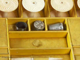 A fully fitted brass inlaid rosewood sewing box with gadrooned edges gilt side carrying handles and gilt feet. Inside the fully fitted sewing tray contains a set of turned ivory spools.  Circa 1810. Enlarge PictureEnlarge Picture