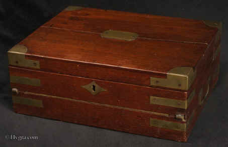 WB458: A mahogany brass bound box which is an example of  a combined dressing case and writing desk. The lift out dressing tray is fitted for holding a man's grooming accessories. This is a very unusual arrangement.  Circa 1800. Enlarge Picture