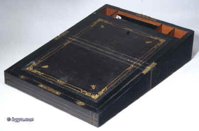 WB171: A coromandel writing box, the front and top inlaid with brass, the sides and back ebonized, opening to a fitted interior with embossed leather writing surface, and compartments for paper and writing instruments, Circa 1860.  Enlarge Picture