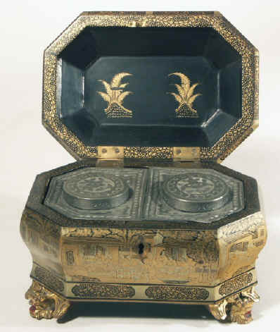 Chinese export lacquer tea chest with scenes of tea trading the interior fitted with metal canisters, circa 1840. chtealac06.jpg (143417 bytes)