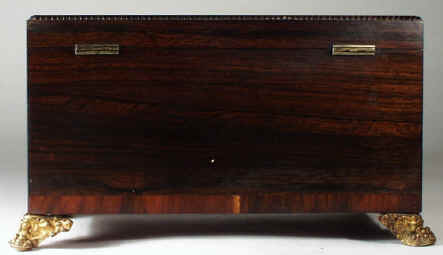 regneo05.jpg (71668 bytes) A Regency Neoclassical Rosewood Tea Chest with Brass inlay Circa 1810.