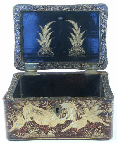 A Chinese export lacquer tea caddy in reddish earth colored lacquer having rounded corners decorated with two colors of gold depicting groups of birds highlighted in red lacquer. Circa 1840