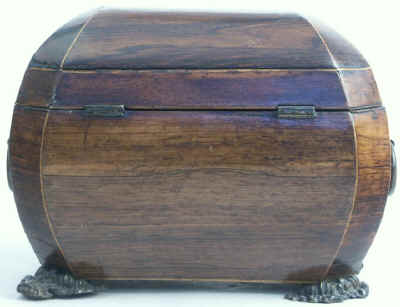 A bombe-shaped Regency  twin compartment tea caddy veneered in rosewood strung with boxwood with embossed feet and handles. Circa 1820.