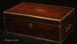 Regency brass edged mahogany writing box with secret drawers, by Thomas Lund of Cornhill, a replacement leather writing surface and compartments for pens and stationery. Circa  1820. The box retains its associated molded glass inkwells (period).