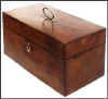 A  Richly Patinated George III three compartment tea caddy in burr yew and edged with  ebony.  Circa 1790. 